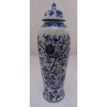 A Chinese early 20th century blue and white baluster vase and cover decorated with lotus flowers,