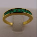 18ct yellow gold channel set emerald ring, approx total weight 2.3g