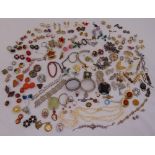 A quantity of costume jewellery to include earrings, brooches, necklaces and bracelets