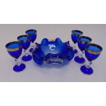 A set of six blue and gold Venetian wine glasses and a blue Murano glass bowl (7)