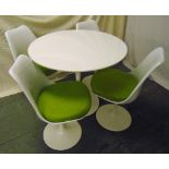 A mid 20th century circular white Tulip table and four matching chairs with detachable cushions,