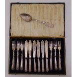 A cased set of fish eaters with silver handles and a white metal serving spoon