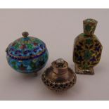 A white metal and enamel pill box, a white metal and enamel bottle and a white metal pill holder,