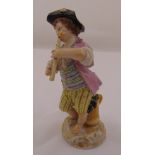 Meissen figurine of a boy playing a flute with grapes in a wooden jug, marks to the base, 12.5cm (