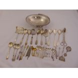 A quantity of silver plate to include a roll basket and flatware