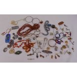 A quantity of costume jewellery to include necklaces, brooches and earrings