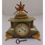 A French late 19th century onyx and gilt metal mantle clock with circular white enamel dial,