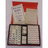 A cased Mah-jong set to include rule book and score cards