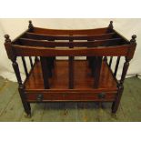 A mahogany rectangular Canterbury with a single drawer, ball finials on original brass castors, 53 x