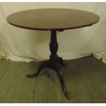 A mahogany circular tilt top occasional table on three outswept legs, 70 x 74cm