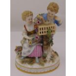 Meissen figural group of children with a bird cage on raised oval base, marks to the base incised