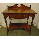 An Edwardian rectangular mahogany hall table with swan neck pediment on four turned supports with