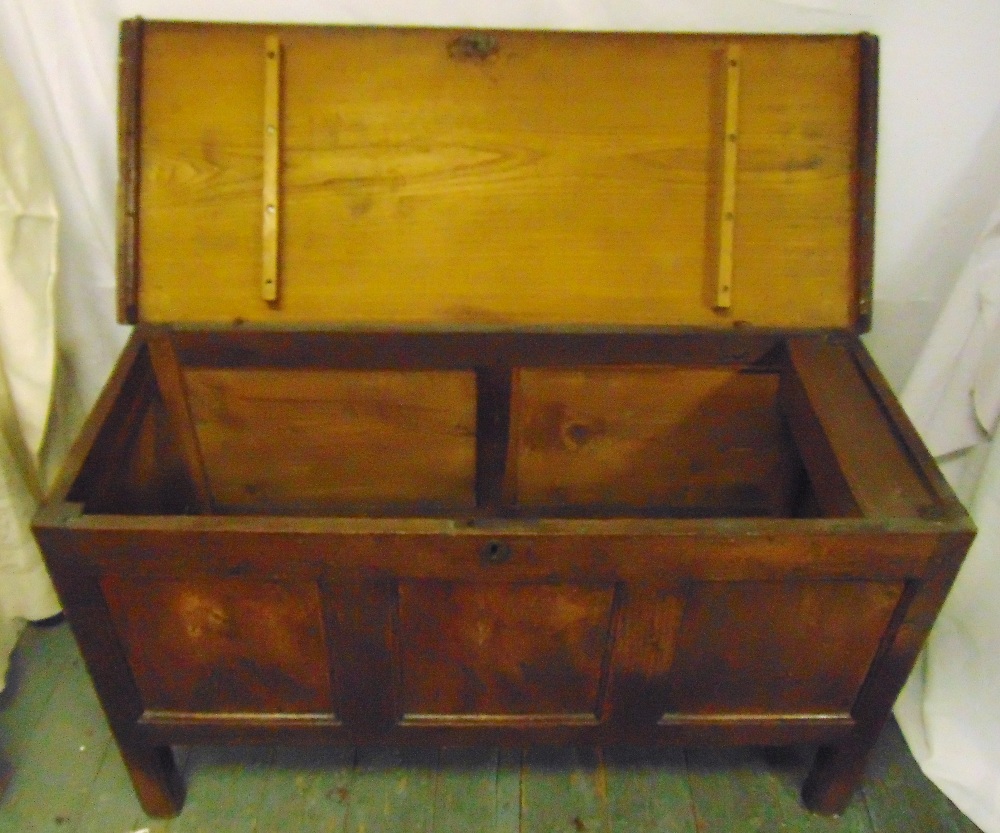 A rectangular oak coffer of panelled form with hinged cover on four rectangular legs, 65.5 x 112.5 x - Image 2 of 2