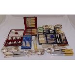A quantity of silver plate to include napkin rings, flatware and servers