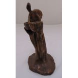 A bronze figurine of a woman supporting a bowl on raised naturalistic base, 23cm (h)