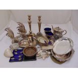 A quantity of silver plate to include a pair of Old Sheffield plate candlesticks, an entr‚e dish and