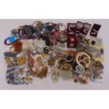 A quantity of silver and costume jewellery to include necklaces, bracelets, rings, brooches and