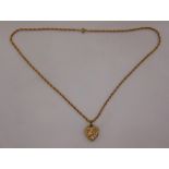 9ct yellow gold heart shaped locket on a 9ct gold chain, approx total weight 9.9g