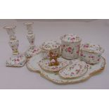 A late Victorian porcelain dressing table set decorated with floral sprays to include a pair of