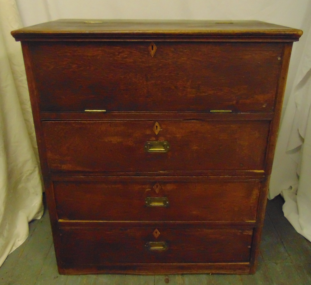 A Colonial Clipper rectangular oak sea chest with three drawers and hinged top section revealing a
