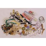 A quantity of costume jewellery to include necklaces, brooches, rings and watches