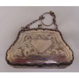 A ladies silver coin purse, hinged sides with suspensory chain, Birmingham 1918, approx total weight