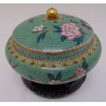 An oriental cloisonn‚ compressed circular dish and domed pull off cover with ball finial decorated