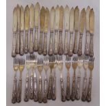 A quantity of Kings pattern fish knives and forks with hallmarked silver handles