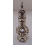 A George III silver sugar sifter, pear shaped with pierced pull off cover later chased with