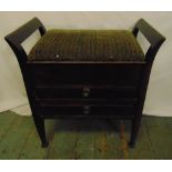 A rectangular mahogany upholstered piano stool with two sheet music drawers and hinged seat, 57.5