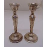 A pair of silver table candlesticks, tapering cylindrical on raised circular bases, Birmingham 1968