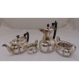 A silver four piece teaset, oval lobed form with scroll border and stylised leaf decoration,