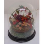 A late Victorian novelty centre piece in the form of a basket of felt and wool flowers and leaves on