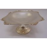 A silver cake stand, shaped octagonal with shell and scroll border on trumpet stand, Sheffield circa