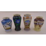 Four Moorcroft enamelware vases with various coloured designs, marks to the bases, 8cm and 9.5cm (