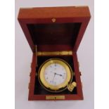 Matthew Norman a quartz nautical gimbal mounted clock in wooden case with hinged cover and brass