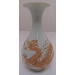 A Chinese Ming style vase decorated with a dragon and bats, four character mark to the base, 27cm (