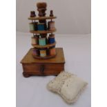 A Victorian wooden sewing caddy of three tier circular form on rectangular base with single on