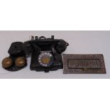 A 1950s black GPO telephone and a brass letterbox cover