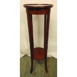 A mahogany plant stand, circular on four tapering rectangular legs, 94.5cm (h)