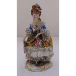 A Chelsea figurine of a lady in 18th century costume on naturalistic base, 17cm (h)