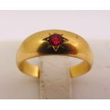 Gold and ruby gypsy set ring, tested 18ct, approx total weight 3.2g
