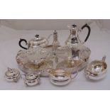 A quantity of silver plate to include a gallery tray, a four piece teaset, condiments and cake