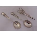 A pair of Victorian silver serving spoons, scroll pierced and engraved with leaves, Sheffield 1889