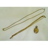 A quantity of 9ct gold to include two chains and a gold plated locket, approx total weight 12.5g