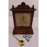 A Victorian rectangular oak cased mantle clock, the silvered dial with Roman numerals, two train