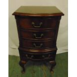 A rectangular mahogany chest of four drawers with swing handles on cabriole legs, 76 x 39 x 32cm