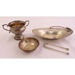 A silver fruit bowl with swing handle, a silver sugar bowl, a silver nut dish and a pair of George