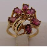 9ct yellow gold cocktail ring set with pink stones, approx total weight 3.4g