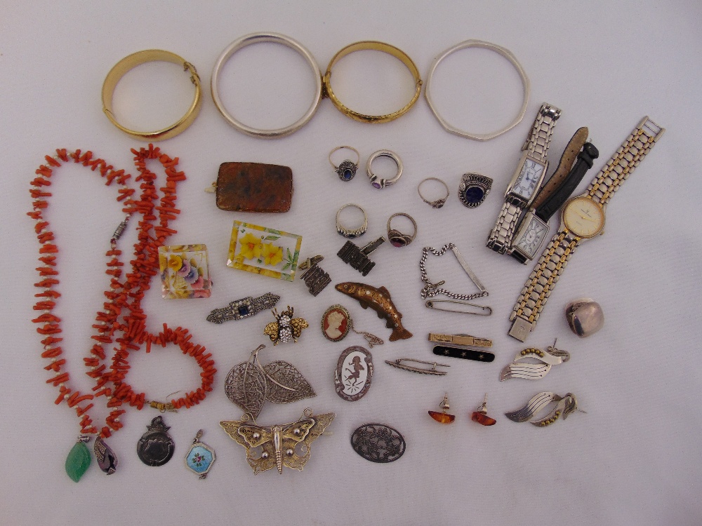 A quantity of silver and costume jewellery to include necklaces, bangles, rings and watches